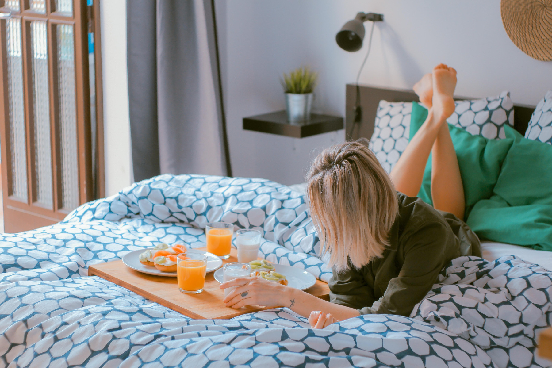 woman eating breakfast in bed